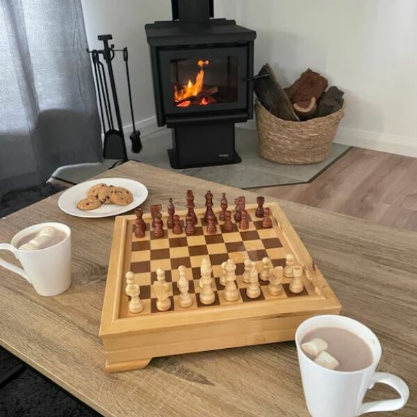 Chess and treats in front of the fireplace