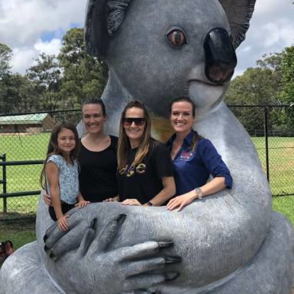 Ladies smiling infront of Giant Koala in Appin