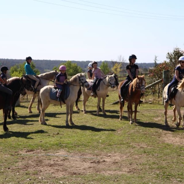 Group of riders listening to the instructor at Hills and Hollows Ponies