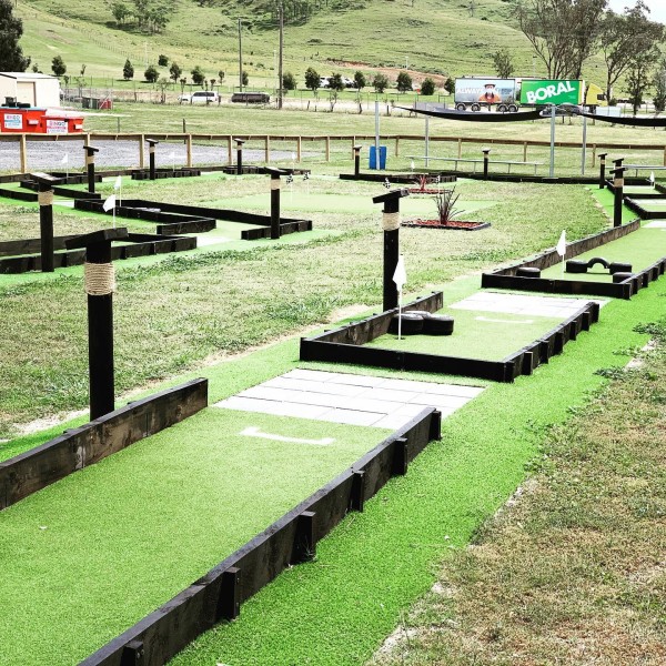 Mini golf course surrounded by rolling hills