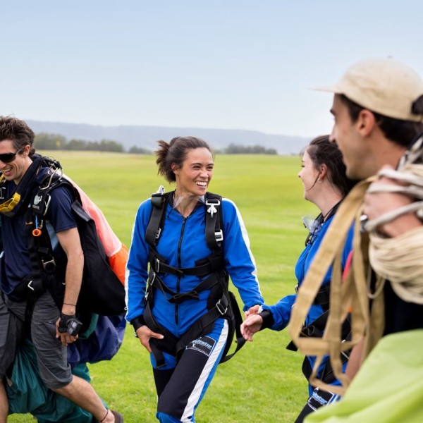 Group of friends post sky dive. Image Credit - Destination NSW