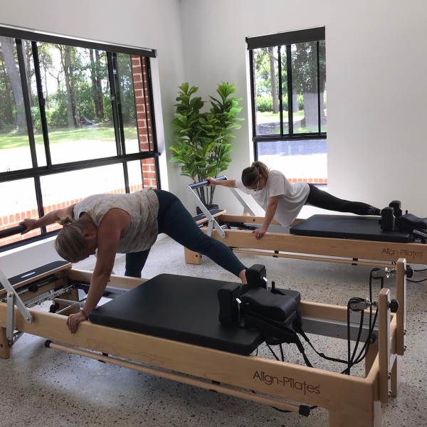 Ladies during a reformer Pilates class