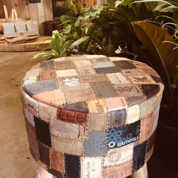 Patchwork stool made with assorted second hand jeans labels