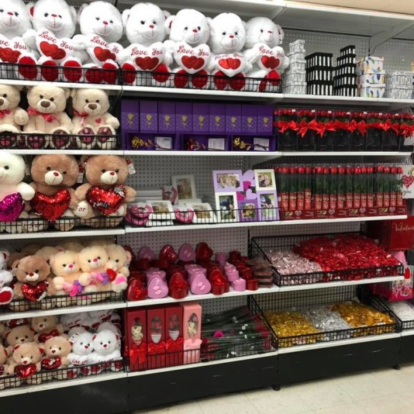 Shelves inside a store stocked with valentines day bears and gifts