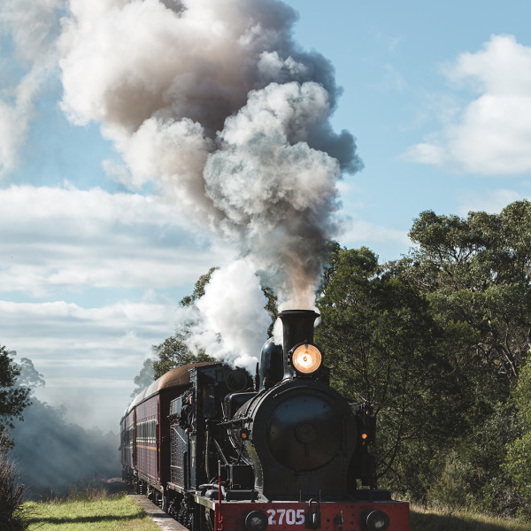 Heritage Steam Train along tracks in Thirlmere