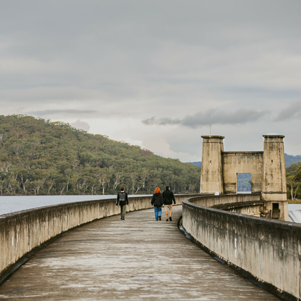 People walking Cordeaux Dam