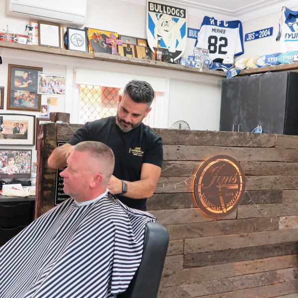 Man getting a haircut at Jims Barber