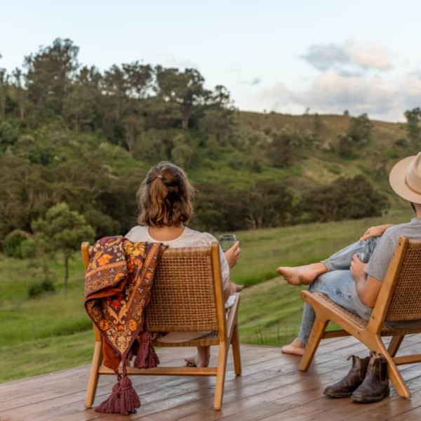 Couple enjoying the view from the Georgie Cabin deck