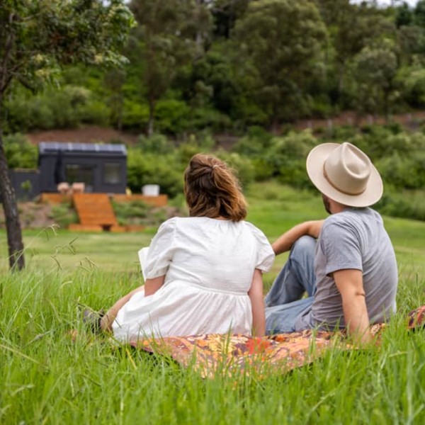 Couple enjoying sitting in the scenic wilderness at Georgie Cabin