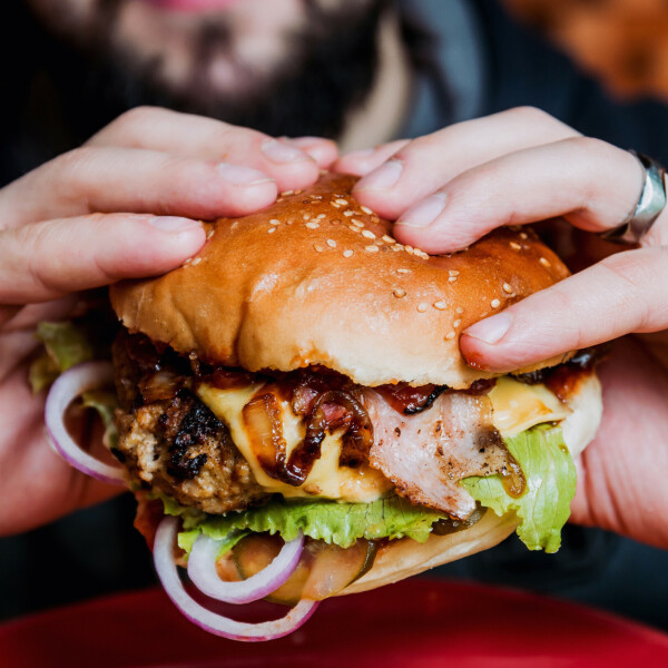 Man eating a big burger 