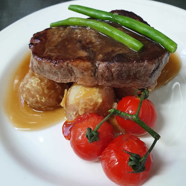 Dinner Plate with Steak, Tomatoes, Potatoes and Greens at Appin House