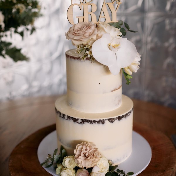 Two tired cream and floral wedding cake