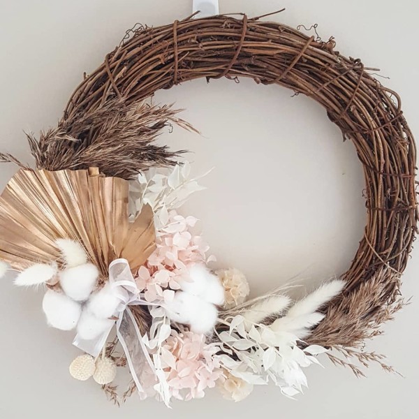 Dried flowers and twine arranged into a wreath